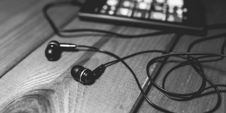 "desk-music-headphones-earphones" by pixellaphoto is marked with CC0 1.0