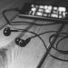 "desk-music-headphones-earphones" by pixellaphoto is marked with CC0 1.0