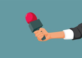 Journalist holing a mic audio recording a reportage