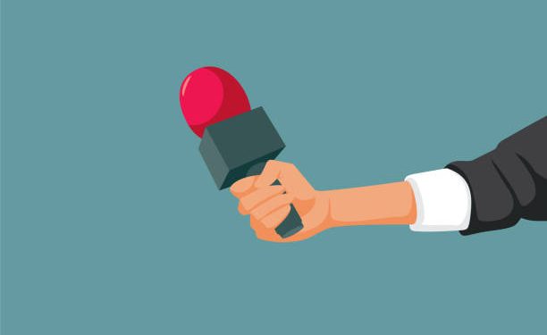 Journalist holing a mic audio recording a reportage