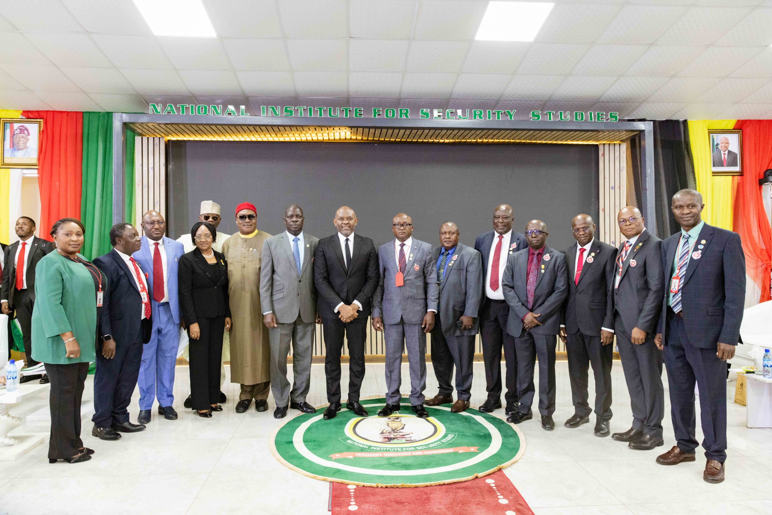Tony Elumelu stands with NISS senior leaders and experts